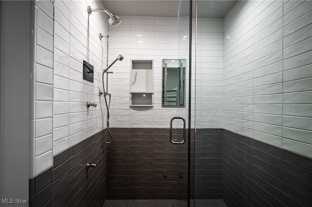 bathroom featuring walk in shower and a textured ceiling