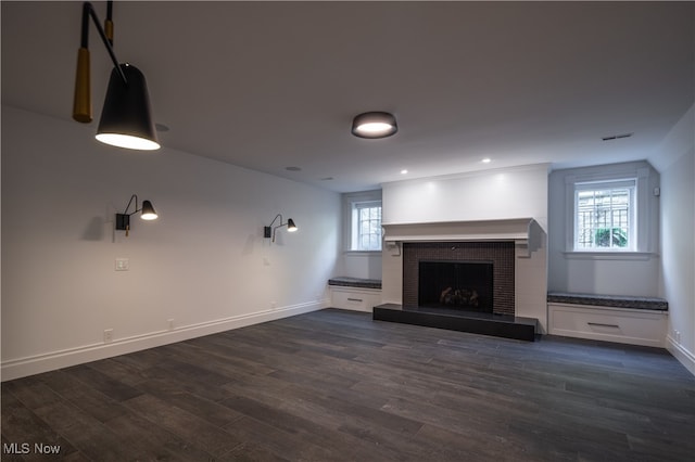 unfurnished living room with dark hardwood / wood-style floors