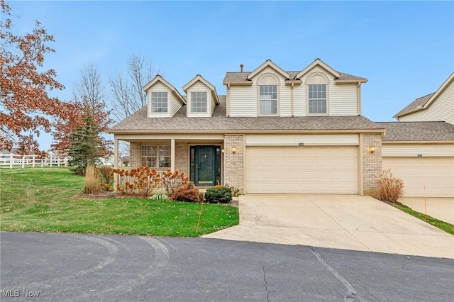 view of front of home with a porch and a front lawn