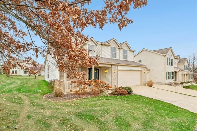 view of front of house featuring a front yard and a garage