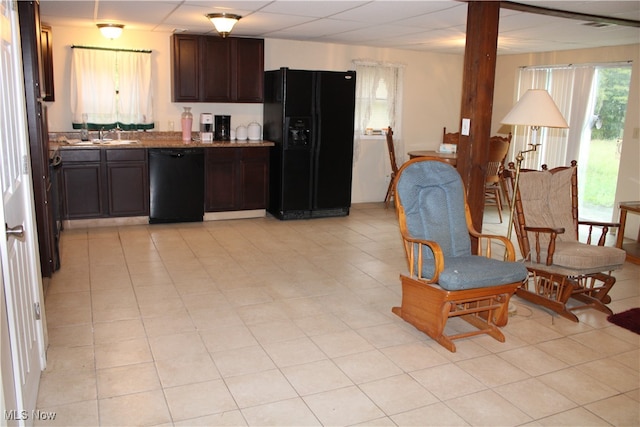 kitchen with dark brown cabinets and black appliances