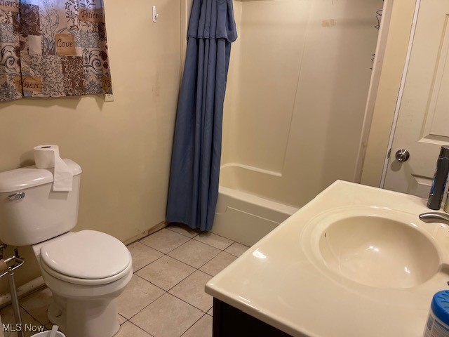 full bathroom with vanity, tile patterned flooring, toilet, and shower / bath combo