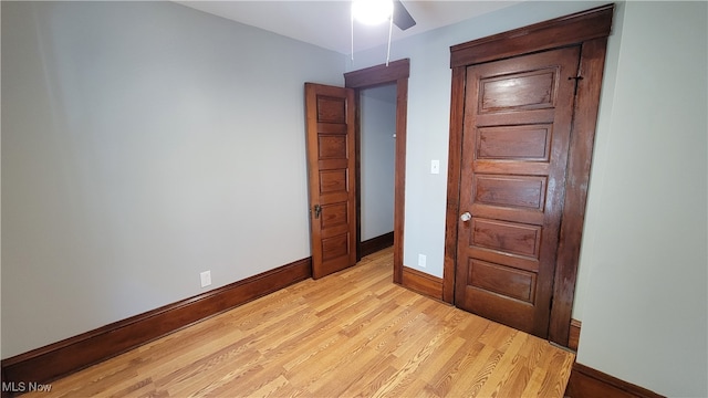 unfurnished bedroom featuring light hardwood / wood-style floors and ceiling fan