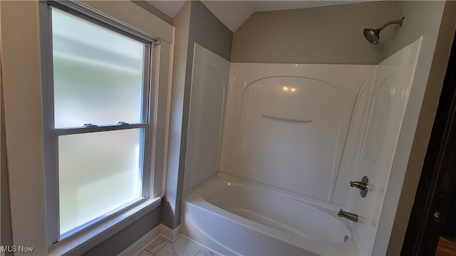 bathroom featuring lofted ceiling and shower / bath combination