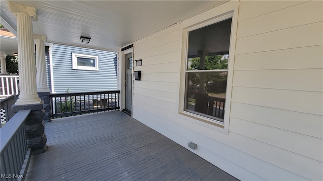 wooden terrace with a porch