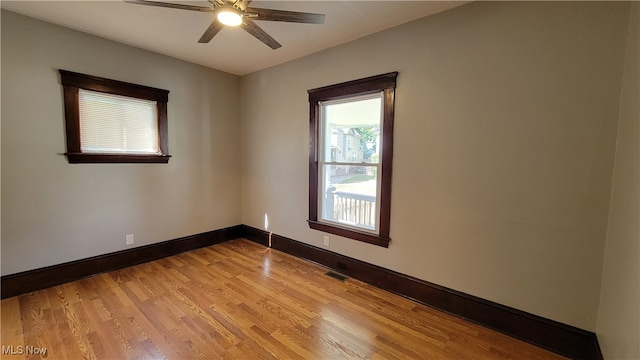 unfurnished room with ceiling fan and light wood-type flooring