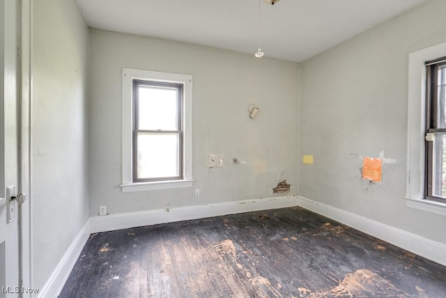 empty room featuring dark hardwood / wood-style floors