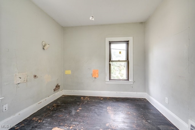 empty room featuring dark hardwood / wood-style floors