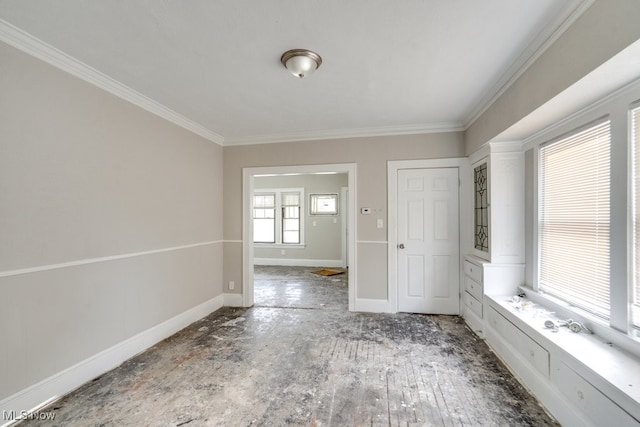 spare room with hardwood / wood-style flooring and ornamental molding