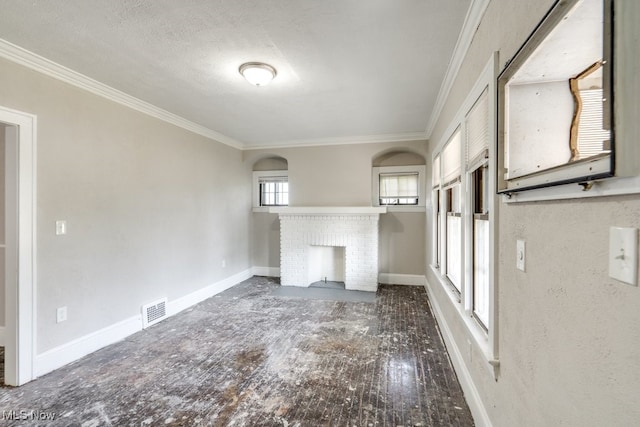 unfurnished living room with ornamental molding, dark hardwood / wood-style floors, and a fireplace