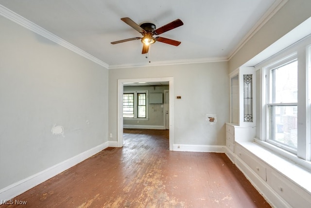 empty room with ceiling fan, dark hardwood / wood-style floors, and ornamental molding