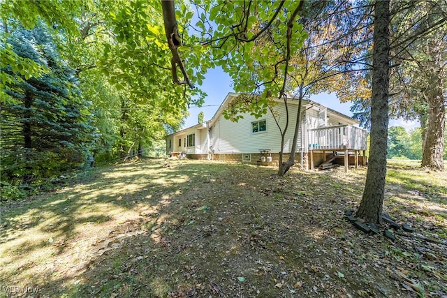 view of yard featuring a wooden deck