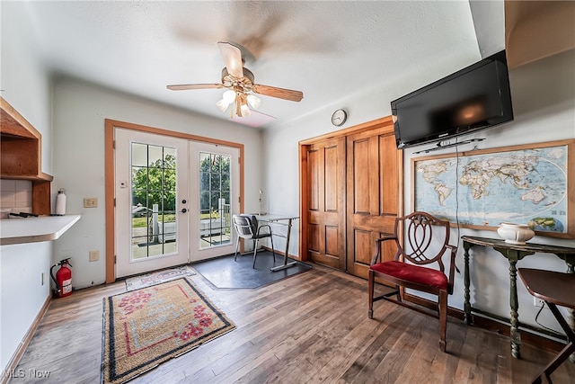 interior space with ceiling fan, french doors, and hardwood / wood-style flooring