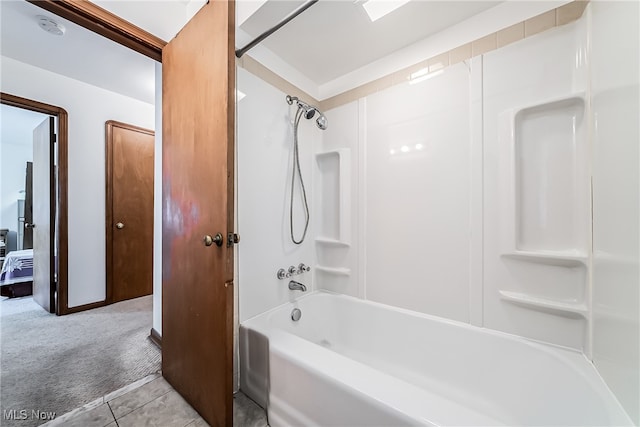 bathroom with bathing tub / shower combination and tile patterned floors