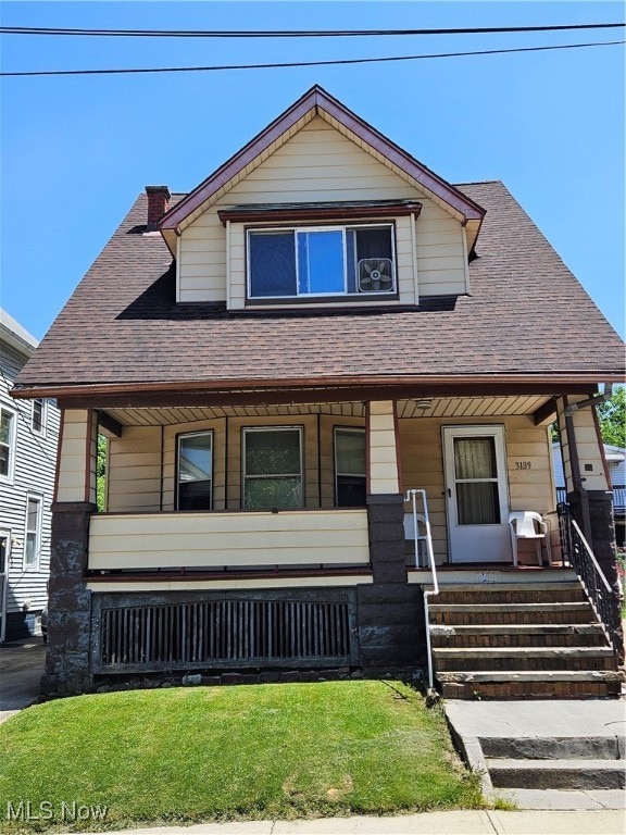 view of front of property featuring covered porch