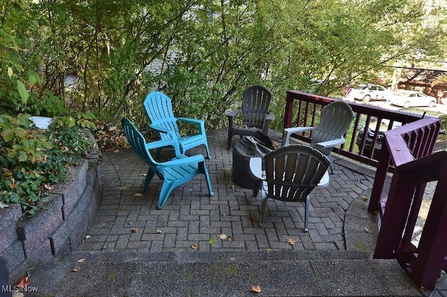 view of patio / terrace featuring a fire pit