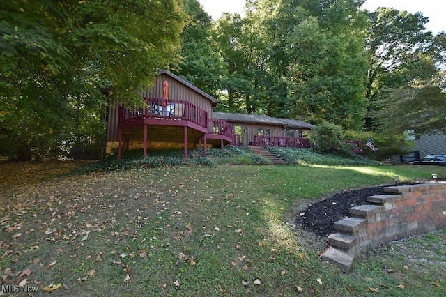 exterior space with a wooden deck and a front lawn