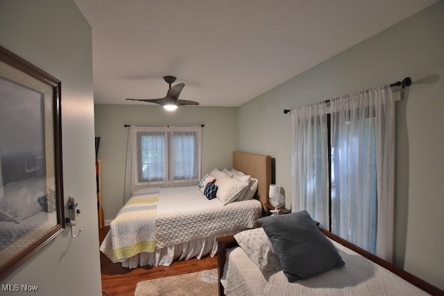 bedroom with ceiling fan and hardwood / wood-style flooring