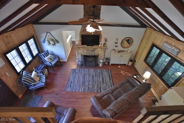 living room with high vaulted ceiling, beam ceiling, dark hardwood / wood-style floors, and a fireplace