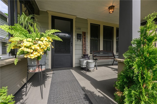 doorway to property featuring covered porch