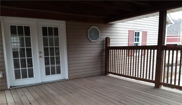 wooden deck featuring french doors