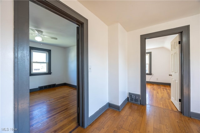 corridor featuring hardwood / wood-style floors