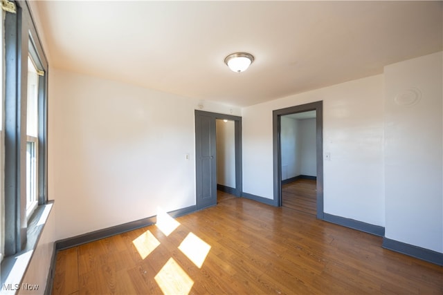 spare room featuring dark hardwood / wood-style floors