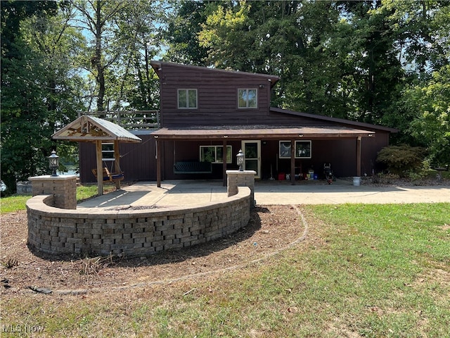 back of house with a yard