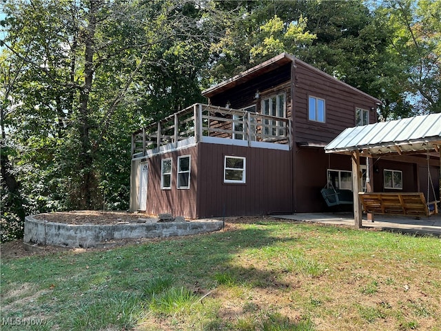 view of home's exterior featuring a patio and a yard