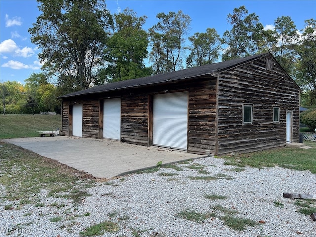 garage with a lawn