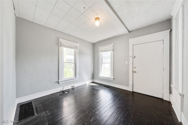 entryway with dark hardwood / wood-style floors