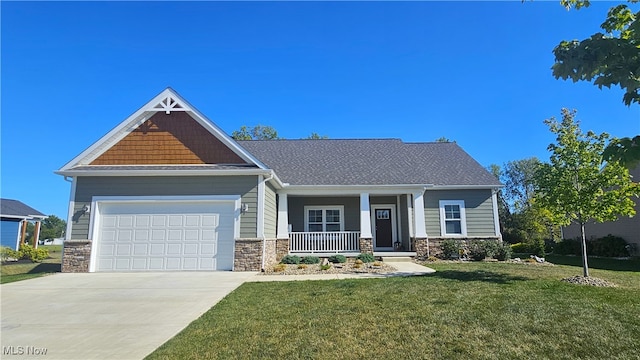 craftsman house featuring a porch, a garage, and a front yard