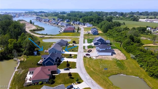 birds eye view of property with a water view