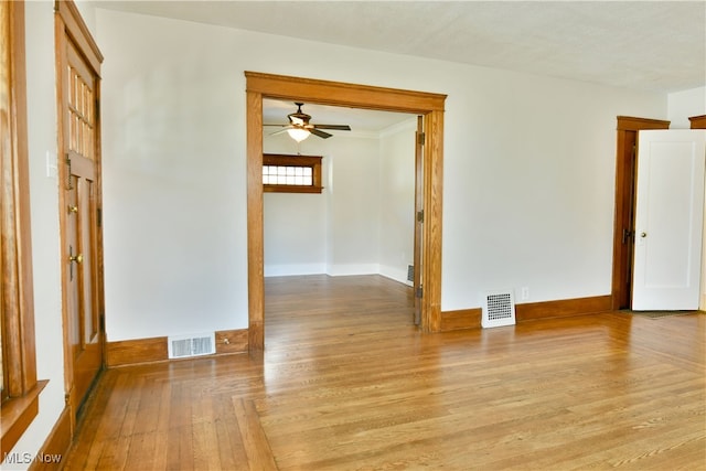 spare room featuring light wood-type flooring and ceiling fan