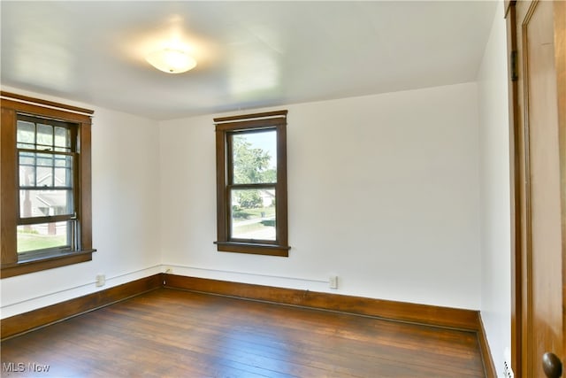 empty room featuring dark hardwood / wood-style floors