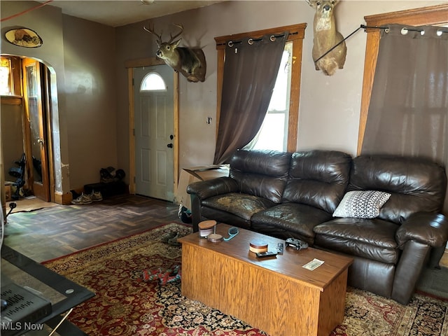 living room featuring parquet floors