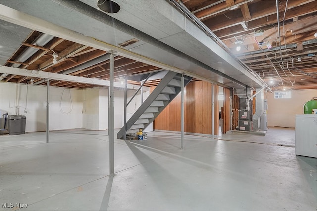 basement with heating unit and washer / dryer