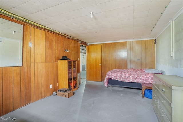 bedroom with wooden walls