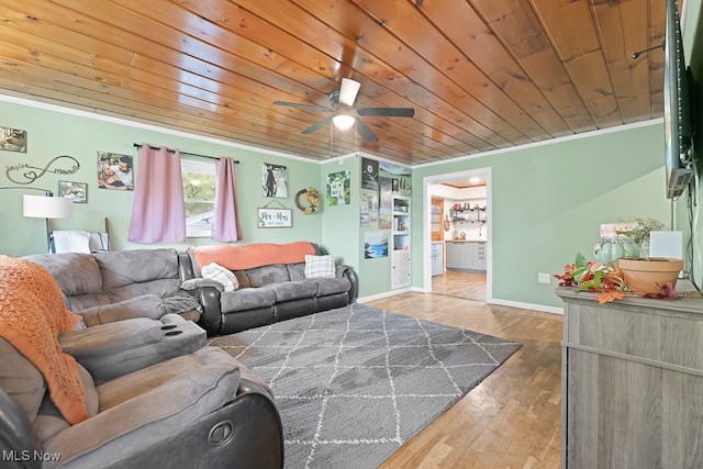 living room with ceiling fan, crown molding, hardwood / wood-style floors, and wooden ceiling