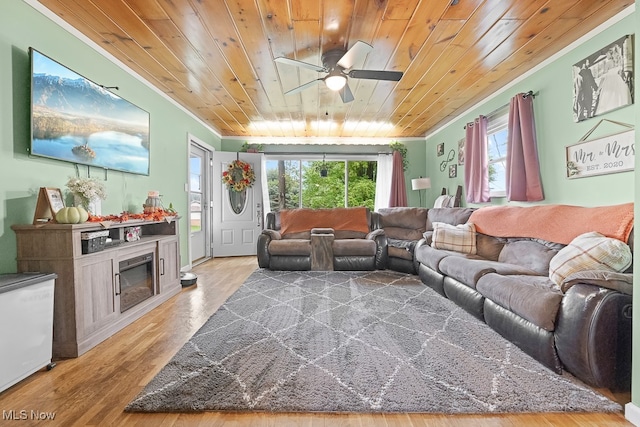 living room with wooden ceiling, ornamental molding, hardwood / wood-style floors, and ceiling fan