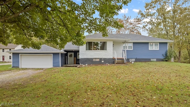 view of front of house featuring a front yard and a garage