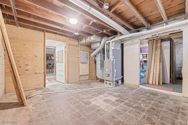 basement with electric panel and heating unit