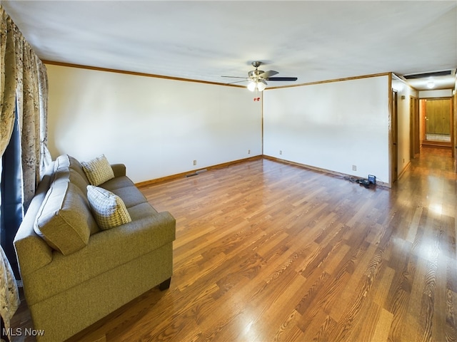 unfurnished living room with ceiling fan, ornamental molding, and hardwood / wood-style floors