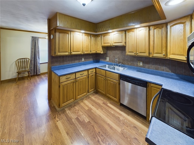 kitchen featuring dishwasher, sink, light hardwood / wood-style flooring, backsplash, and ornamental molding