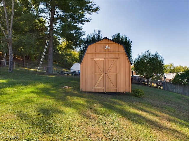 view of outbuilding featuring a yard