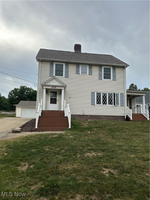 back of house with a yard