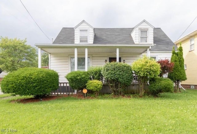 view of front of property with covered porch and a front yard