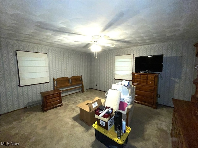 interior space with ceiling fan