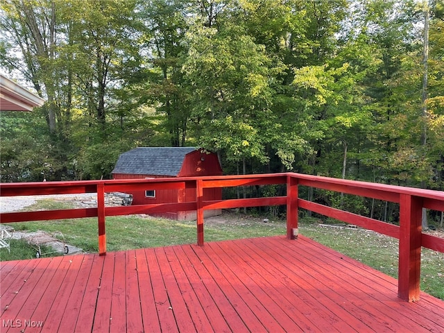 wooden deck with a storage shed