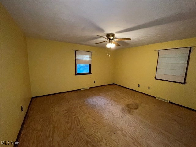 unfurnished room featuring ceiling fan and light hardwood / wood-style floors